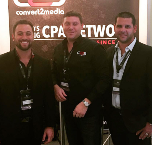 Photo of Kyle, Aaron, and Mike at a trade show